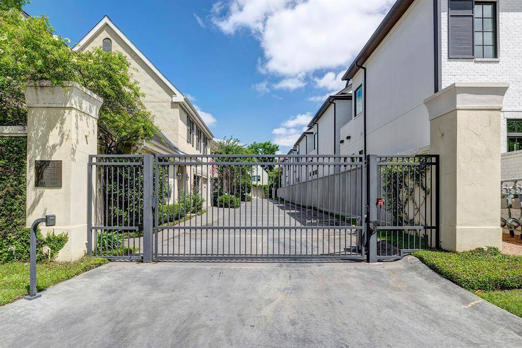 The gate on Longmont which is an exceptionally wide street.  5134 is the third house back and invisible from the road.  This is indeed a very special group of four unique homes in a fantastic location.