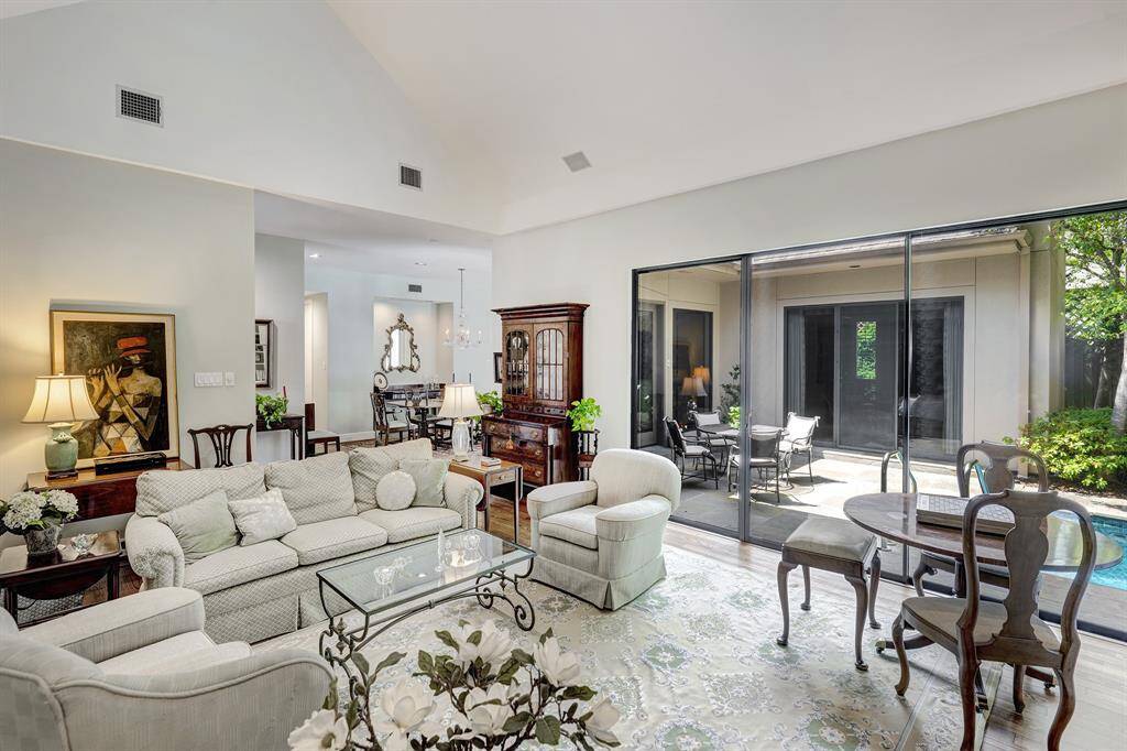 The living room showing the views of the patio and pool bringing the outside in.