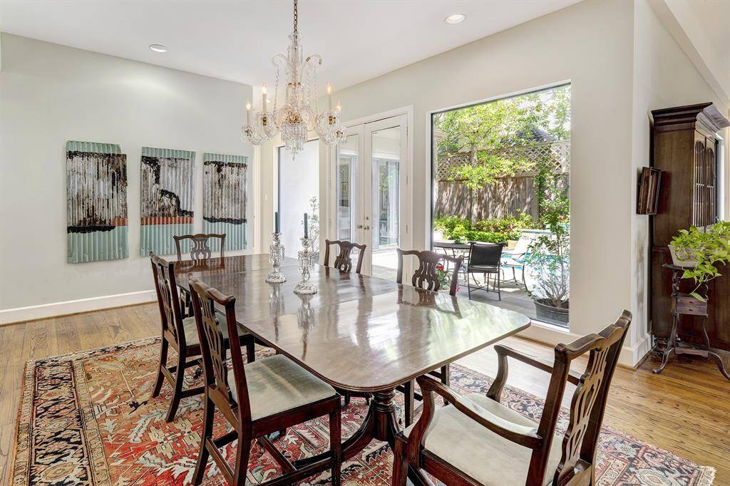 Wall of glass overlooks the pool and flagstone patio, charming day and night.