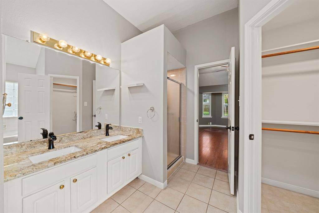 primary bathroom with dual sinks