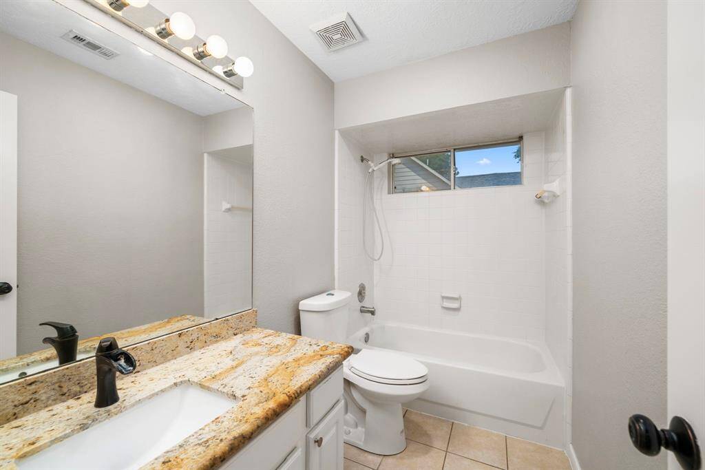 Secondary bathroom with updated granite counertop