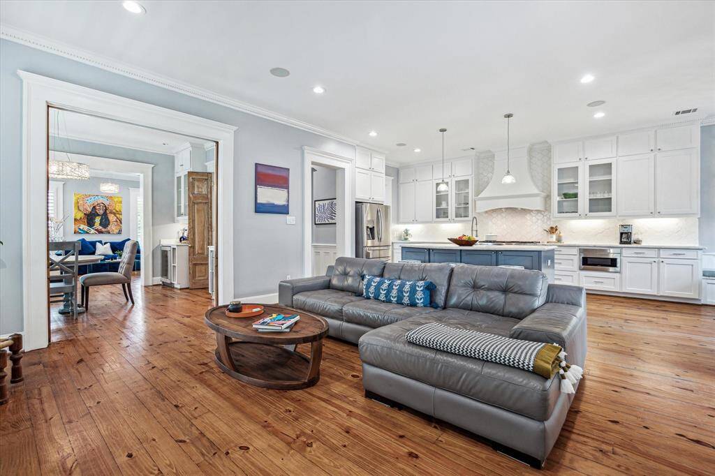 Designed with everyday living and entertaining in mind, the open floorplan unites the spacious family room, beautifully appointed kitchen, and charming breakfast nook into one harmonious space filled with natural light.