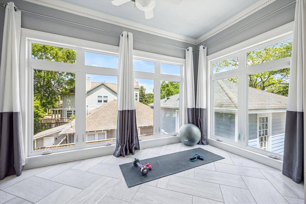 Barn doors open to an adjoining bonus space.