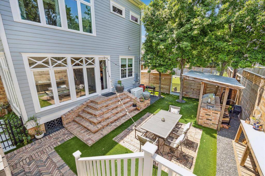 Accessible from the sunroom, the backyard offers a seamless indoor-outdoor flow.