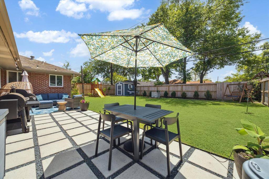 This backyard is a dream! Recent pavers installed, beautiful landscaping and new fence.