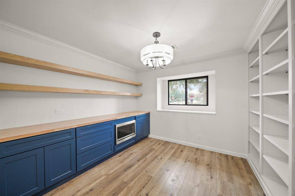 A spacious walk-in pantry with an additional oven provides ample storage and convenience for cooking enthusiasts.