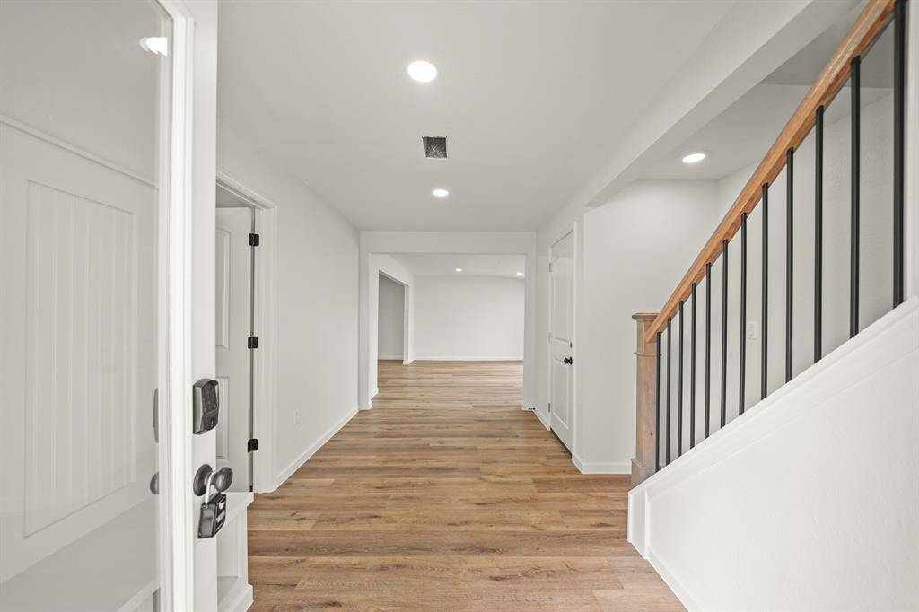 The wide staircase leads to the upstairs 4th bedroom/garage apartment with full bath. This mud room keeps the rest of the house clean and tidy.
