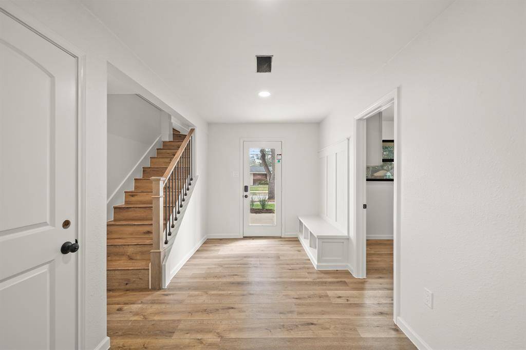 Generous primary bedroom features gorgeous flooring, high ceiling, a huge window and an ensuite bathroom. **Room has been virtually staged.