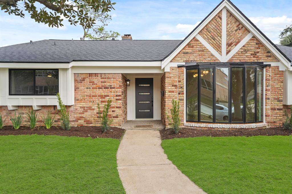 Stunning brick exterior complimented by the professionally landscaped front yard.
