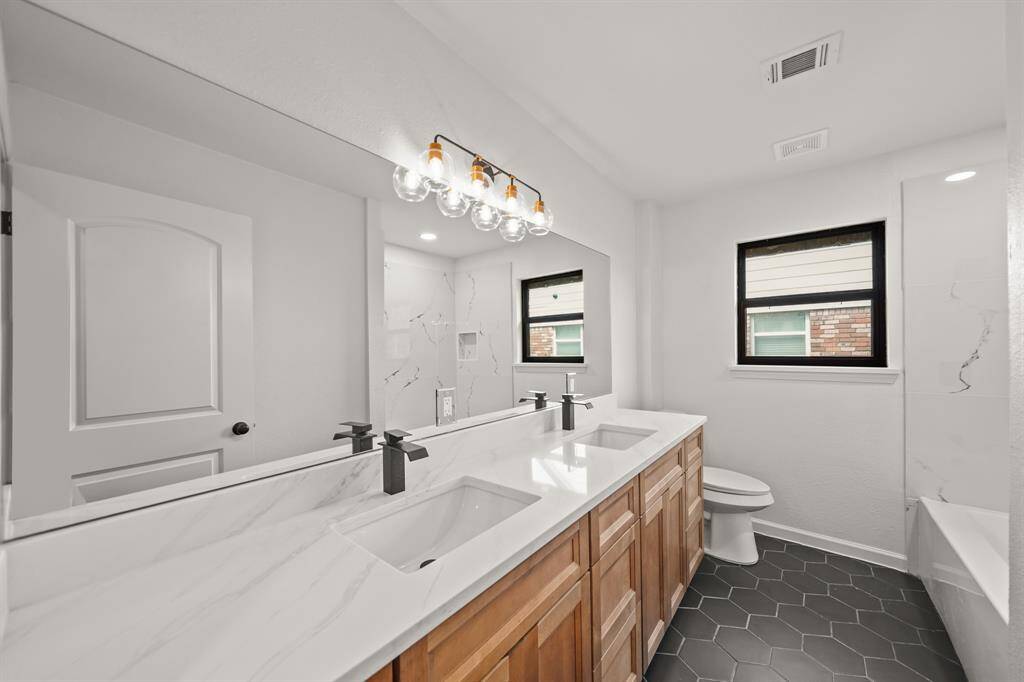 Another angle of this spacious secondary bedroom with a relaxing ensuite bathroom. ^^This room has been virtually staged.