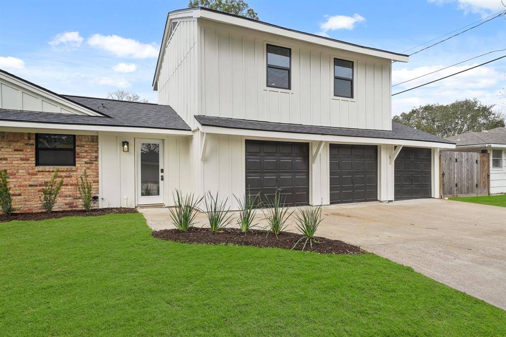 This stunning aerial view showcases a beautifully situated home on a spacious corner lot, offering excellent curb appeal and added privacy.