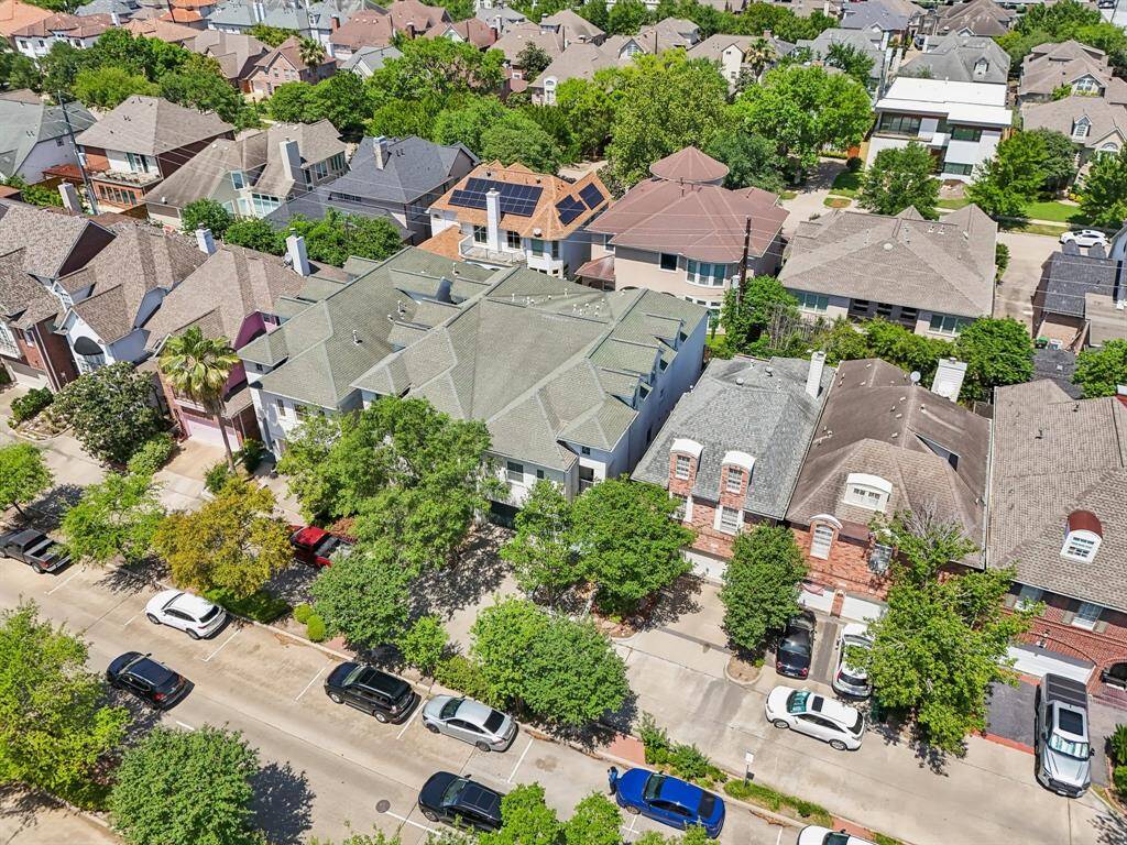 This photo showcases a aerial view of the home.  This section of Hidalgo Street is tree-lined and offers ample parking on both sides for guests and residents.