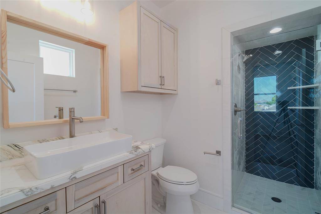 en-suite 1st floor bathroom with a built-in standing shower.