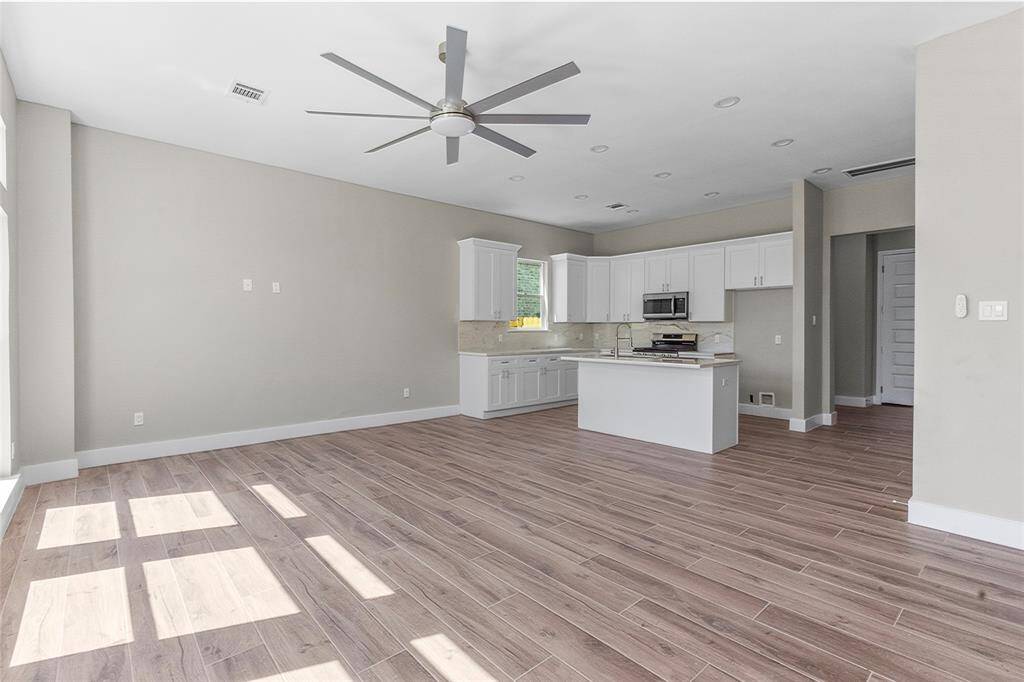 Open living room with load of lighting