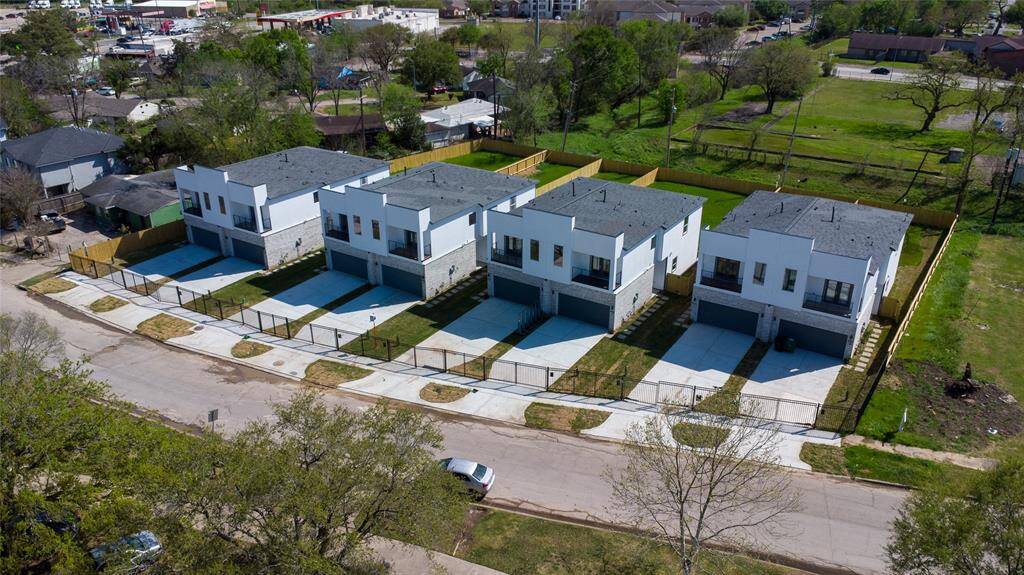 2nd home from right showing metal gate entry