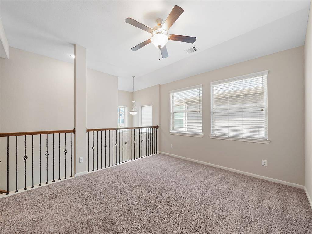 The upper level features a versatile loft area/game room, offering endless possibilities for relaxation and recreation.
