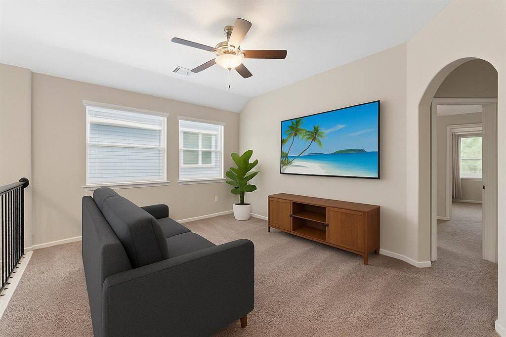 Virtually staged: This adaptable loft space transforms effortlessly into a vibrant game room, a cozy reading nook, or a productive home office.