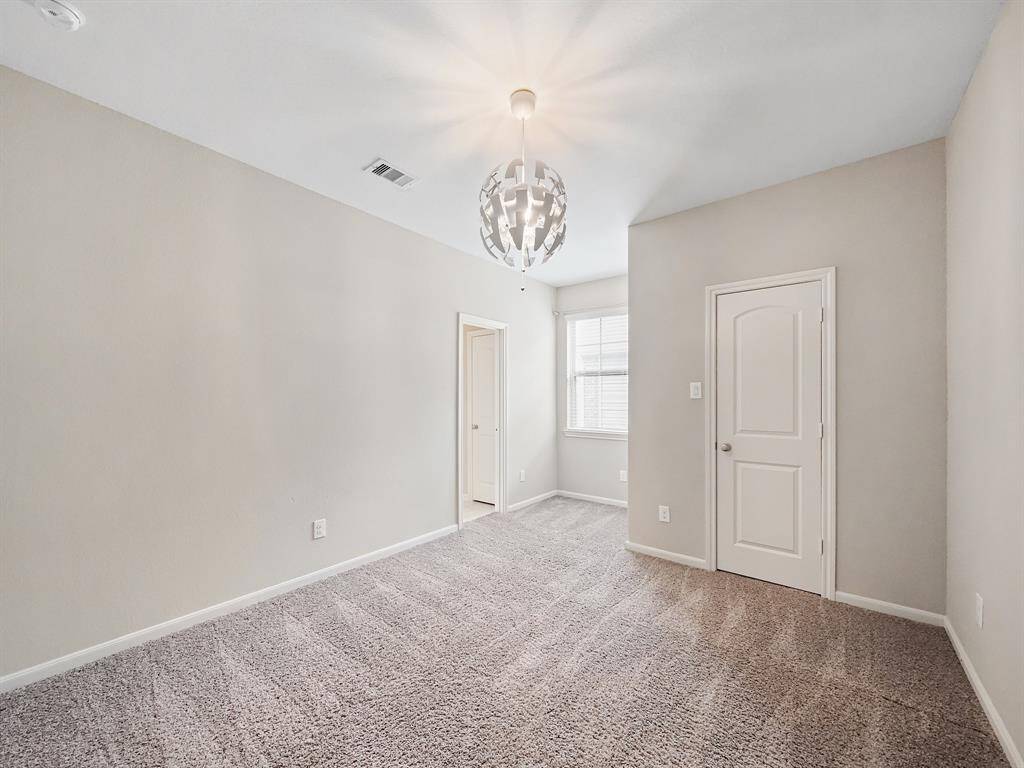 Spacious secondary bedroom #2 has high ceiling and private access to the secondary bathroom.