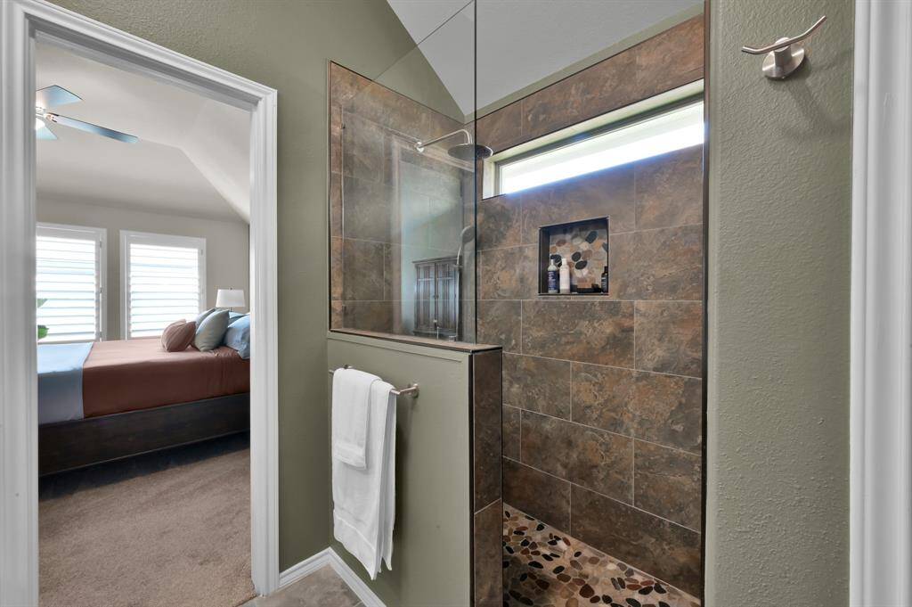 Texas-sized walk-in shower with TWO shower heads.