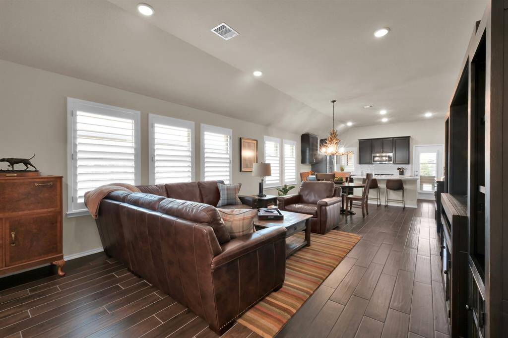 The home features 3 bedrooms, 2 bathrooms, an open concept, & boasts natural light throughout.