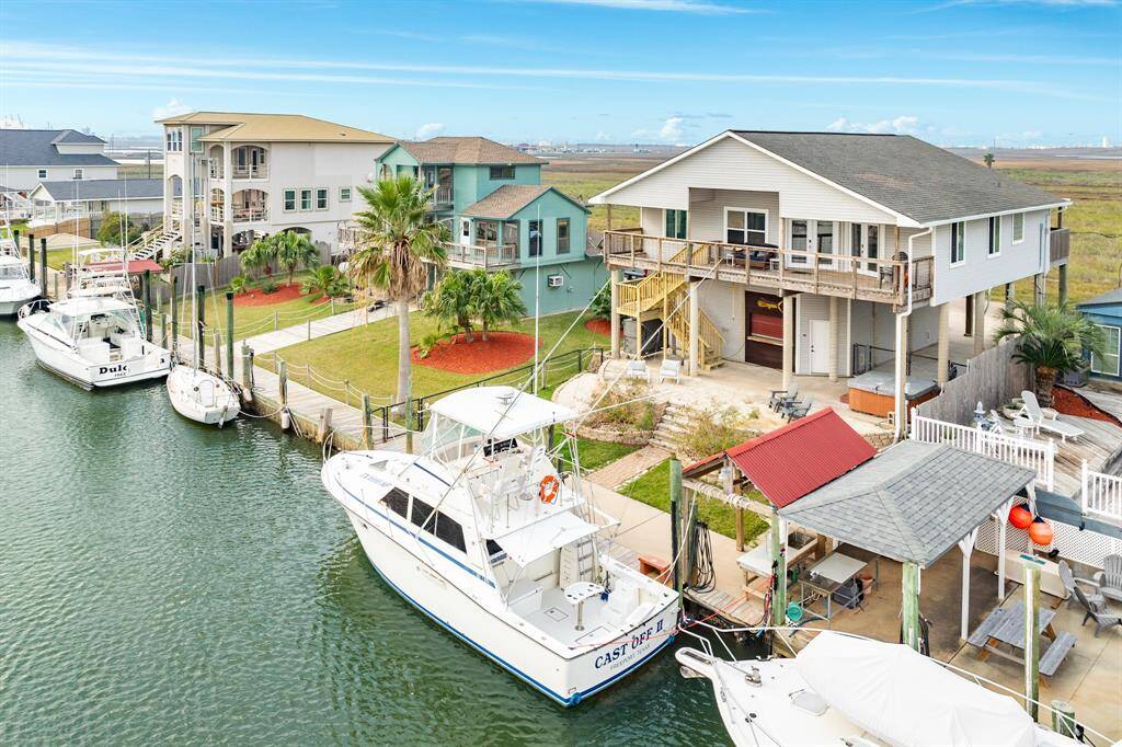 56 Marlin overlooks the canal and is surrounded by a well-maintained yard and neighboring homes. Ideal for boating enthusiasts and those seeking a serene waterside lifestyle.