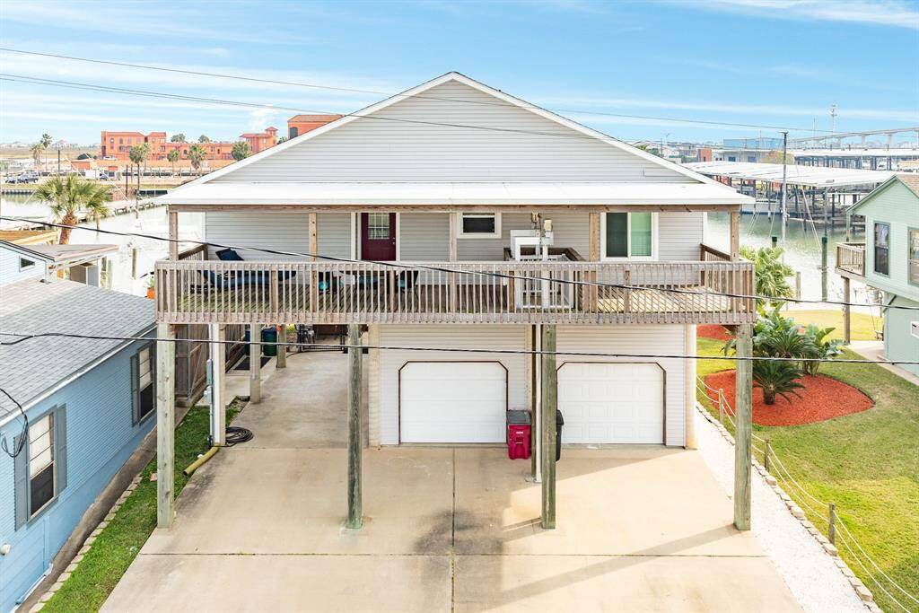 Rear view of 56 Marlin with another  spacious deck additional parking and a double garage. Ideal for canalfront living.