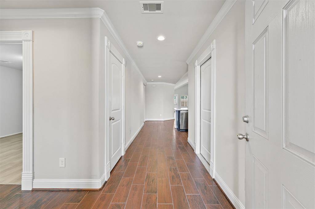 Entry to this home with secondary bedrooms to the left.