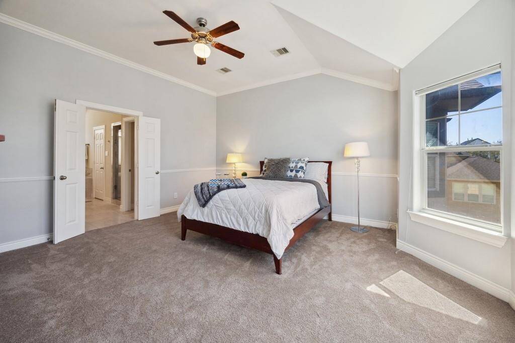 Primary bedroom with ensuite bathroom and two closets
