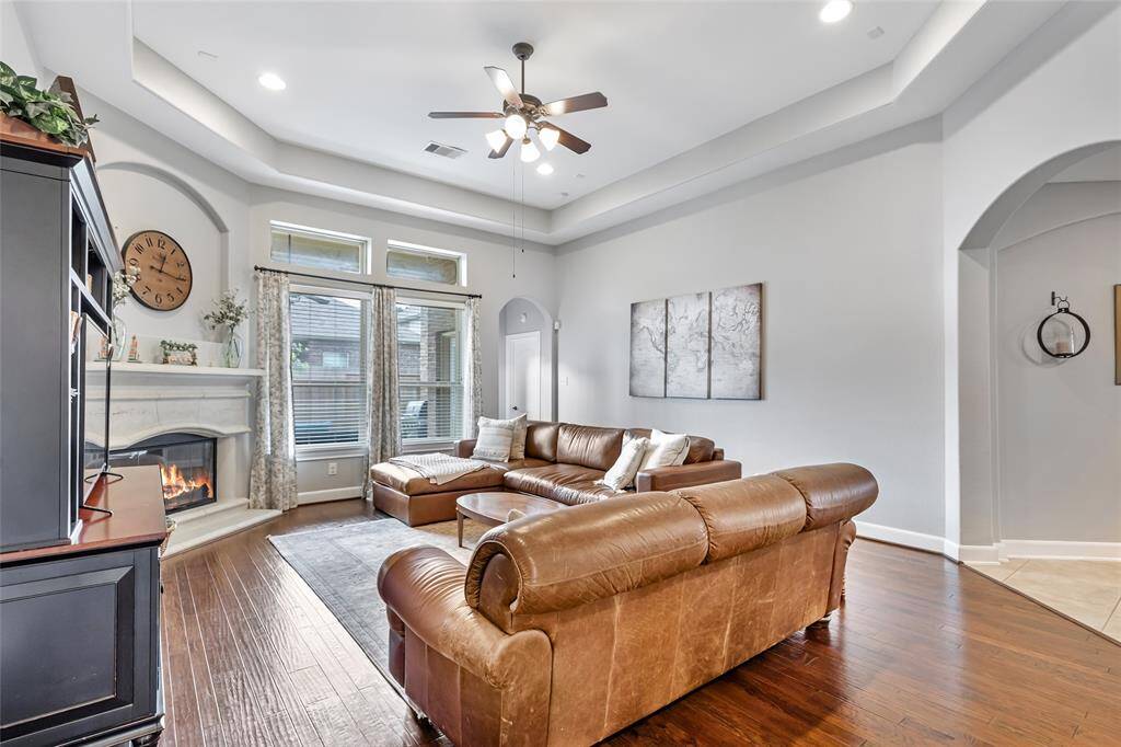 Living Room with Tray Ceiling & Gas Log Fireplace