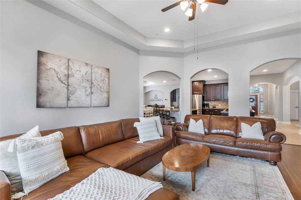 Living Room with Tray Ceiling & Gas Log Fireplace
