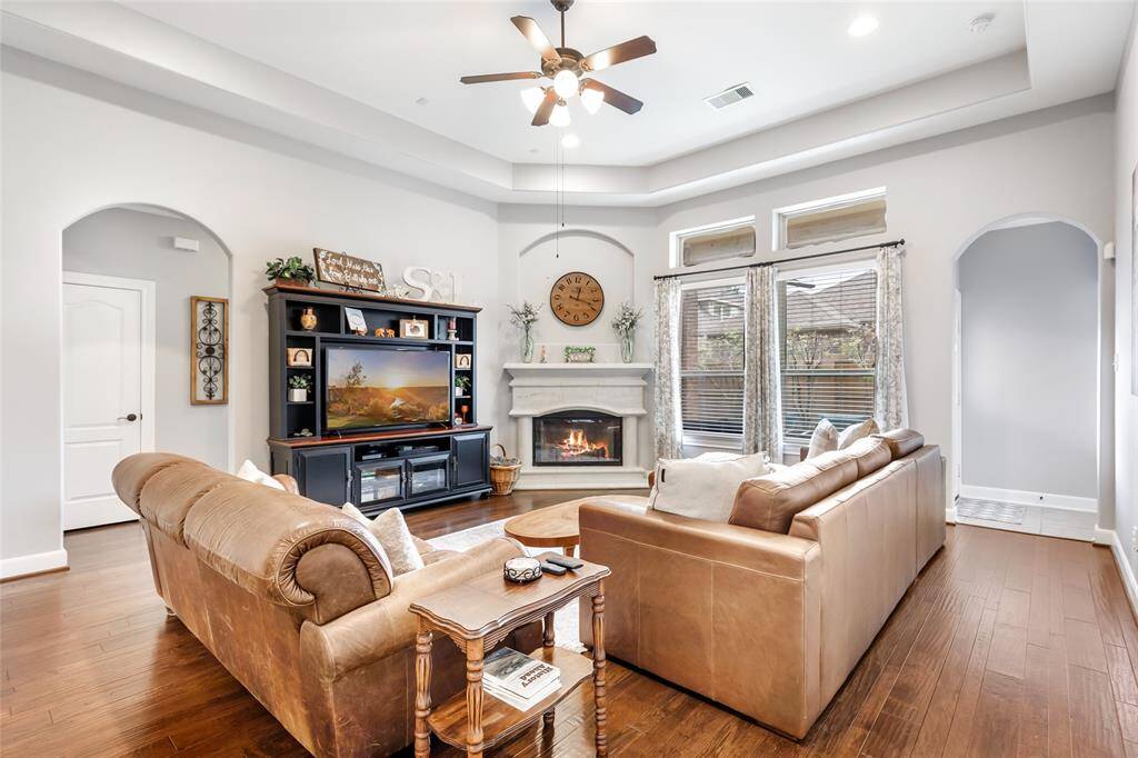 Living Room with Tray Ceiling & Gas Log Fireplace