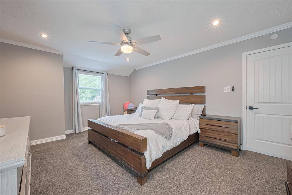 Primary suite is spacious, enough room for a seating area overlooking the front lawn