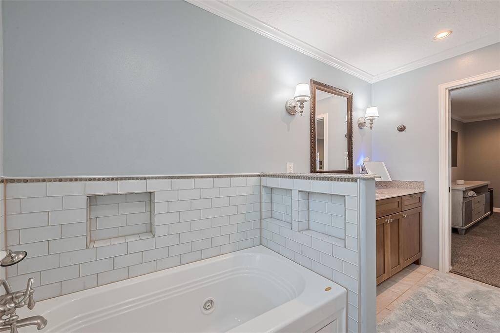 Indulge in spa-like relaxation in your luxurious primary bath.