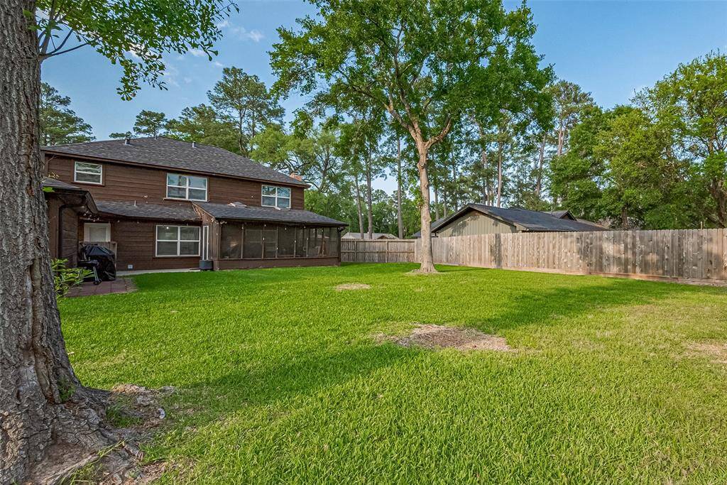 Screened porch and a recent fence replacement adds privacy, creating an inviting outdoor environment.