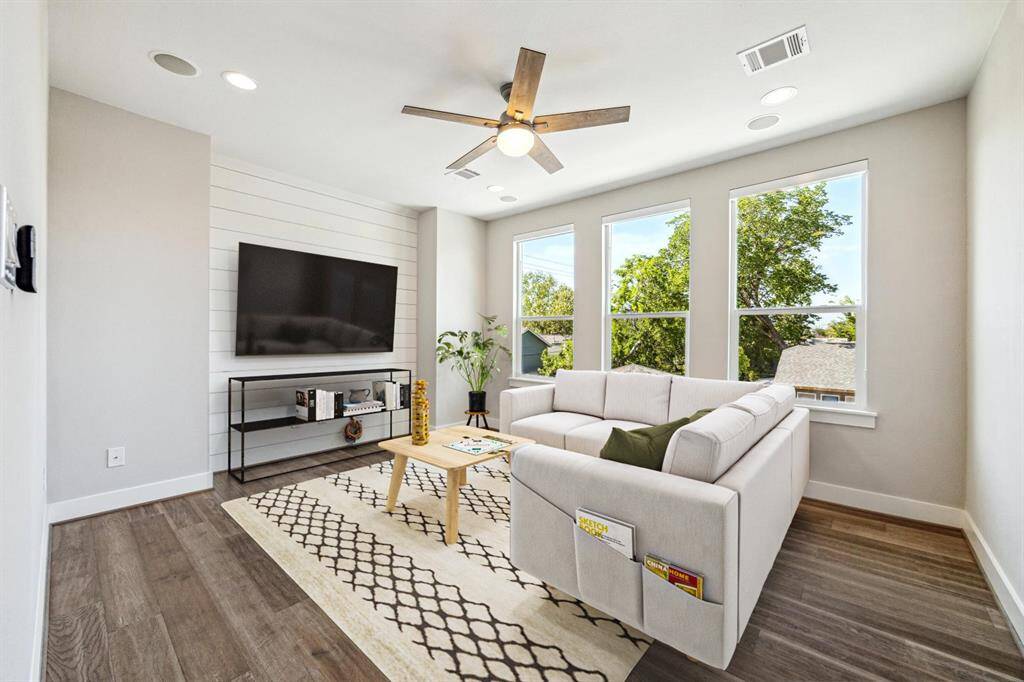 The thoughtfully designed mud room is equipped with shelving and coat rack + bench.