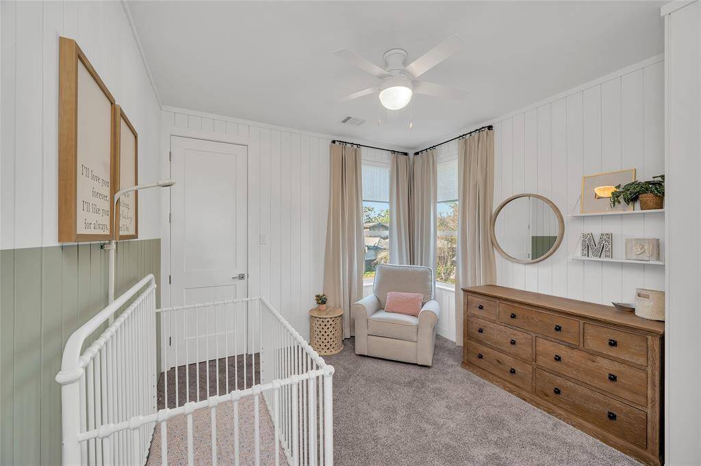 2nd floor: this secondary bedroom features plush carpeting + walk in closet.