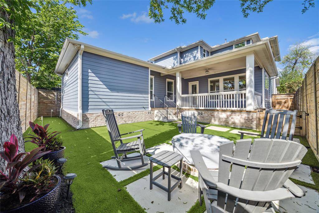 Look forward to spending cozy nights surrounded by the fire pit in this picture perfect backyard.