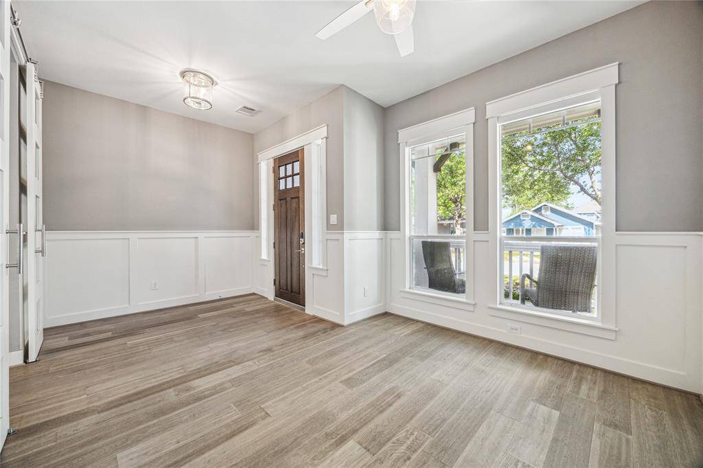 Additional flex space located just off of the entry is perfect for a home office or can easily transition into a cozy formal living area.