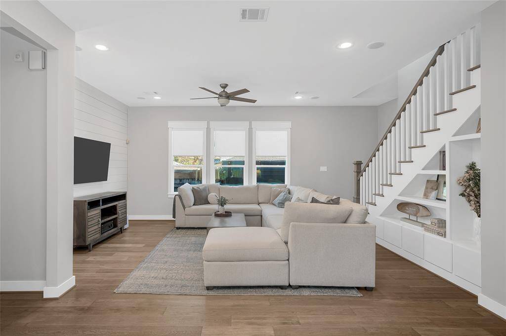 Alternate living room perspective. Note the custom built in shelving perfect for family photos/display.