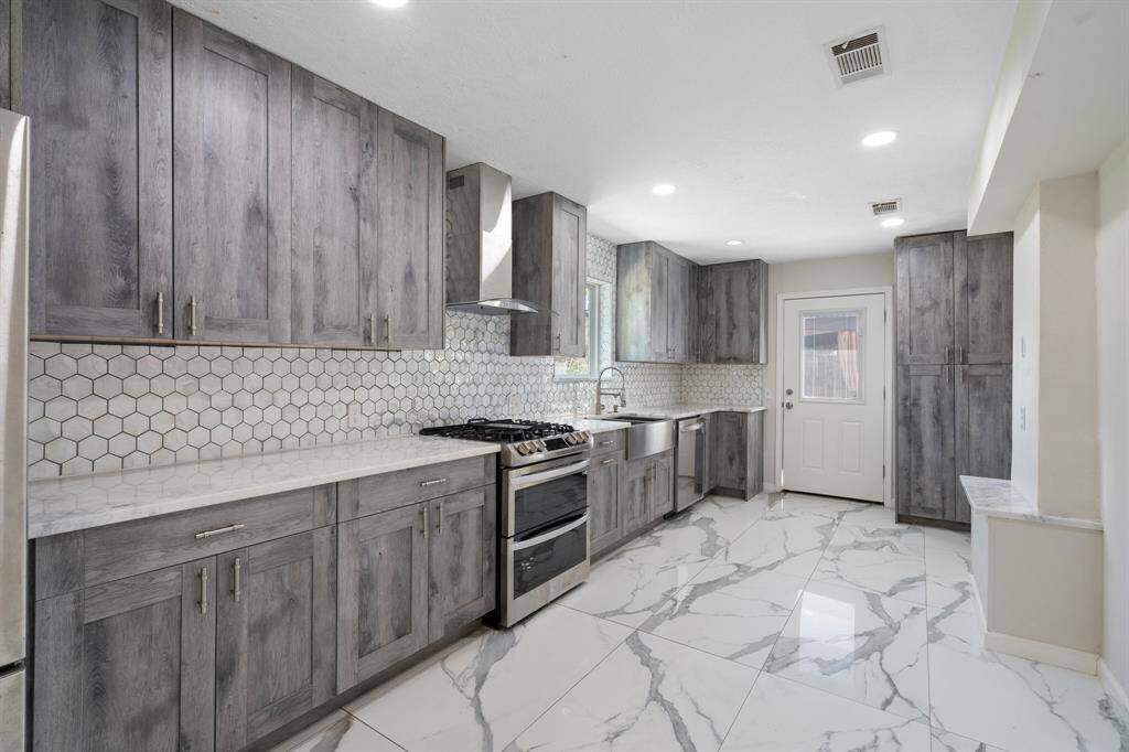 Checkout the Large Beautiful Spacious Updated Kitchen with plenty of cabinet space.