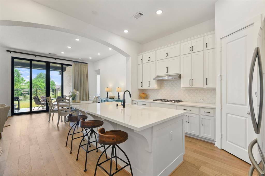 The chef of the house will surely appreciate the roomy corner pantry, the all-stainless appliances that include a 5-burner gas cooktop & a built-in microwave, the apron front farmhouse sink, and the beautiful views to enjoy while working!