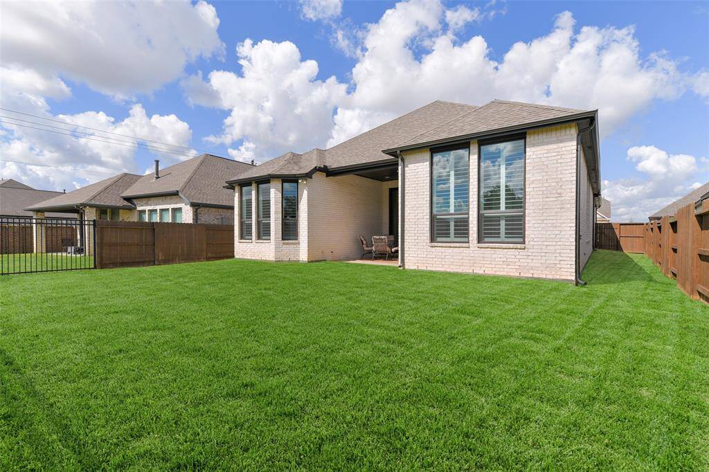 Enjoy a lush carpet of St Augustine grass in your fenced backyard or head over to enjoy the neighborhood amenities that include a park, a dog park, and trails.