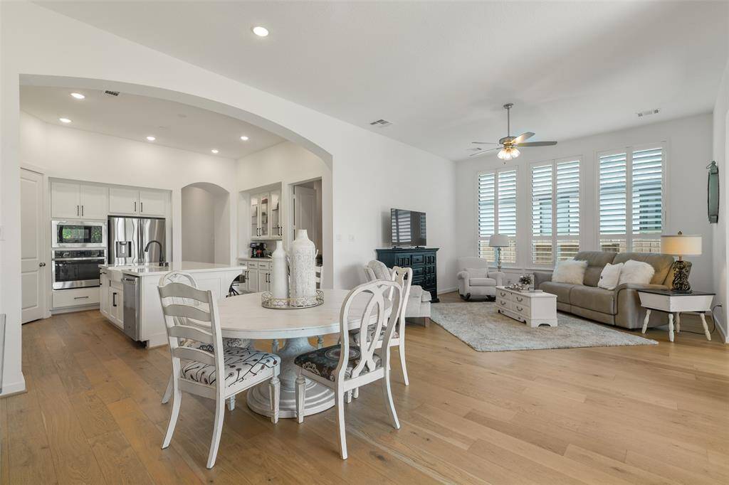 Note the seamless transitions between the living spaces shown here! The center hallway opens up into this magnificent island kitchen, cozy family room, and sunlit breakfast room. It's a perfect design for entertaining or everyday living!