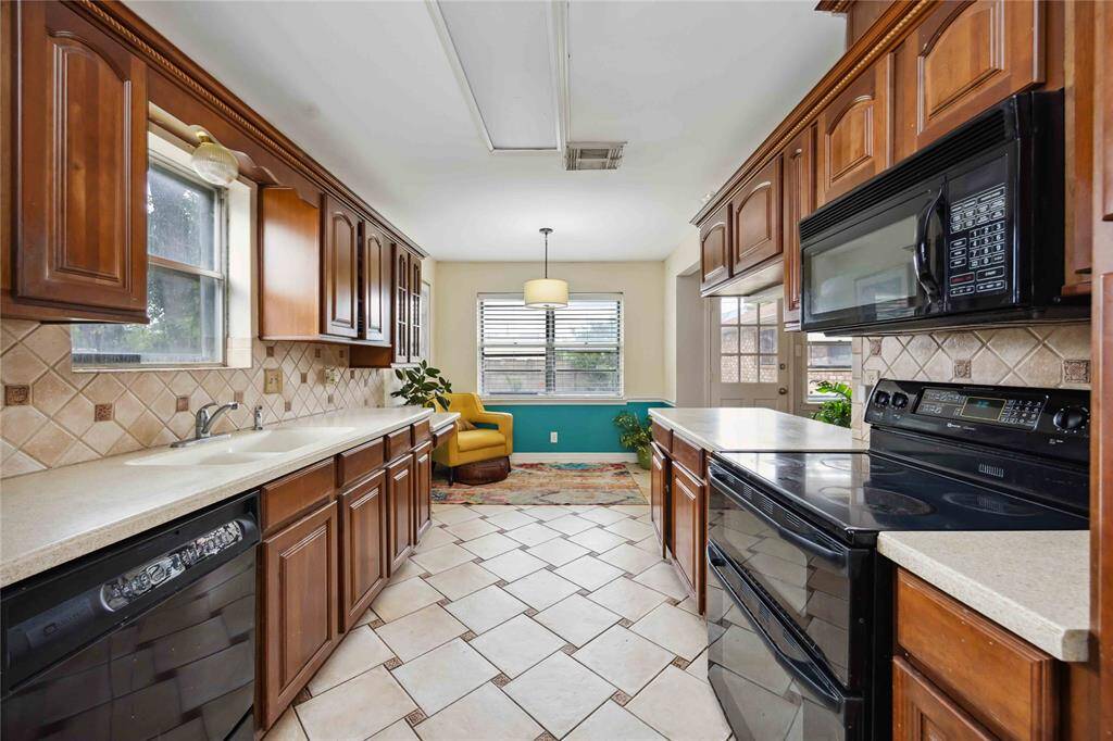 As you enter the kitchen from the dining room, you can see just how much space is available here.