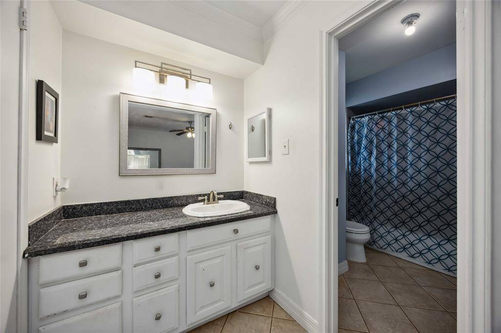 The primary bath is attached to this open vanity area.