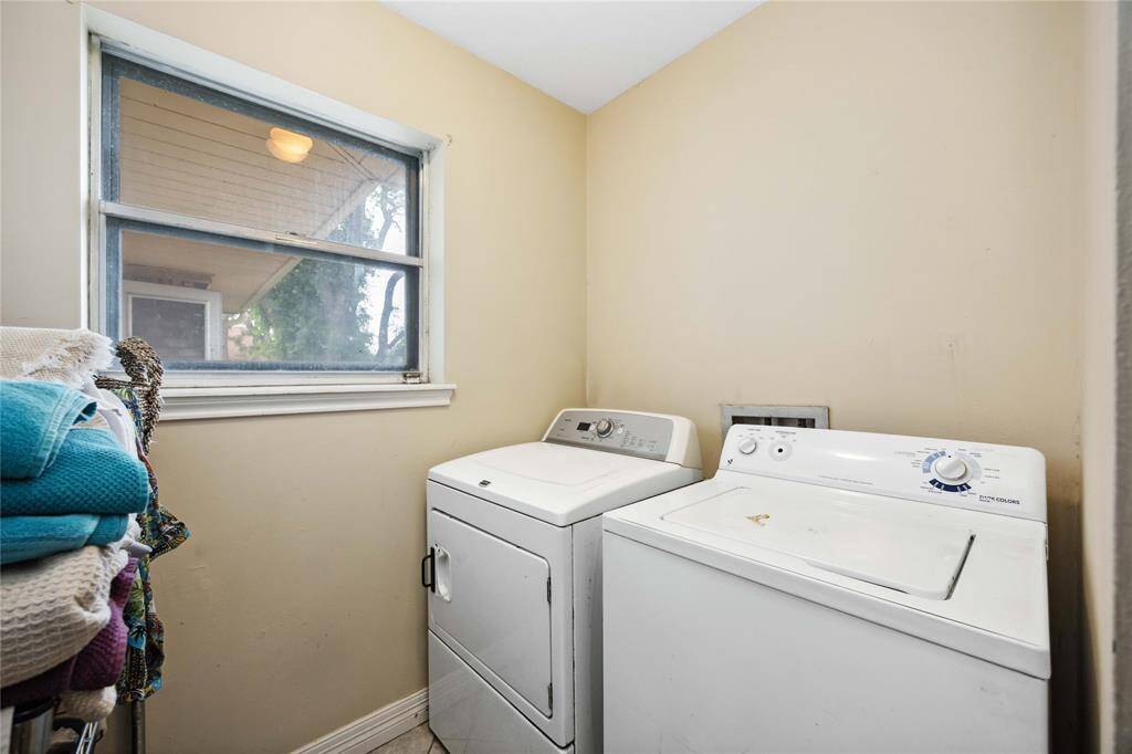 The indoor utility room offers an electric dryer connection. There's room to add some built-in shelving.