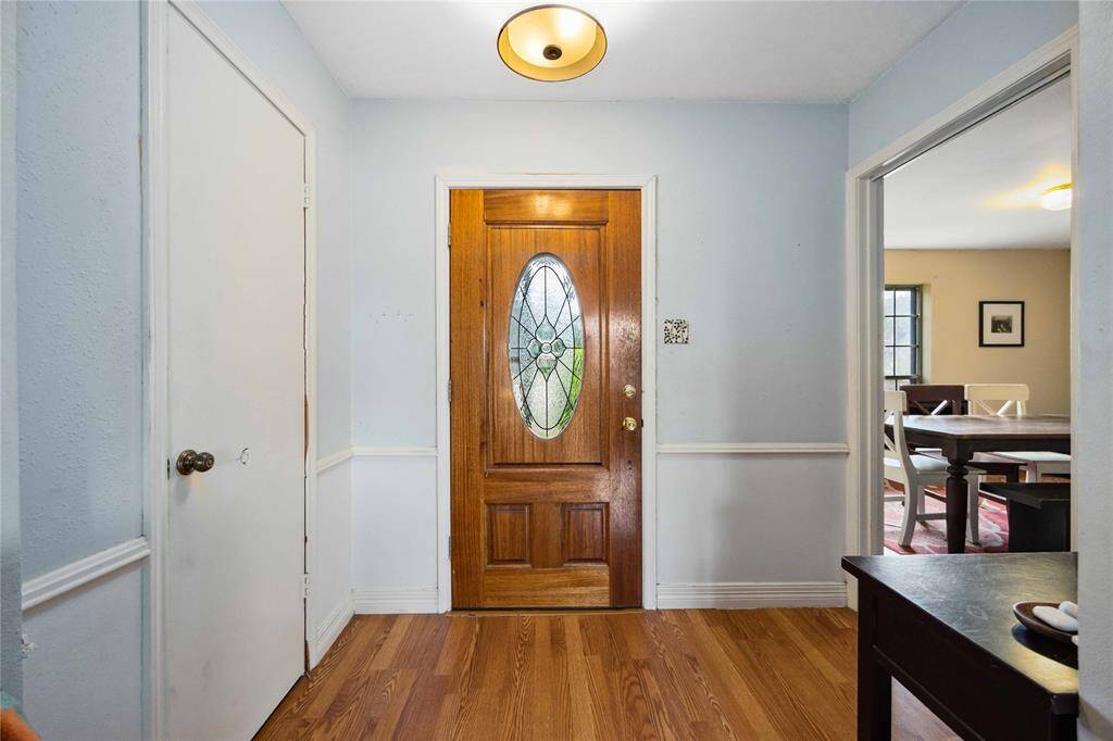 Laminate floors run continuously throughout the main gathering spaces. As you enter the home, on your left you'll find a formal dining room.