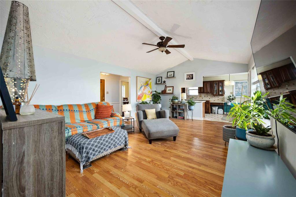 From this view, you can see toward the front door on the left and into the dining room. The living room joins the kitchen and breakfast room where the flooring changes.