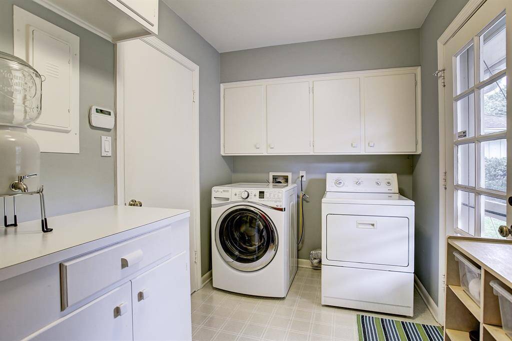 Huge Utility Room. Washer & Dryer included! Great cabinets & counter space.