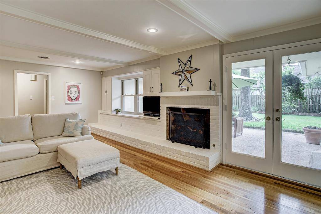 Fabulous Family room with fireplace & French Doors to large covered patio & fenced yard.